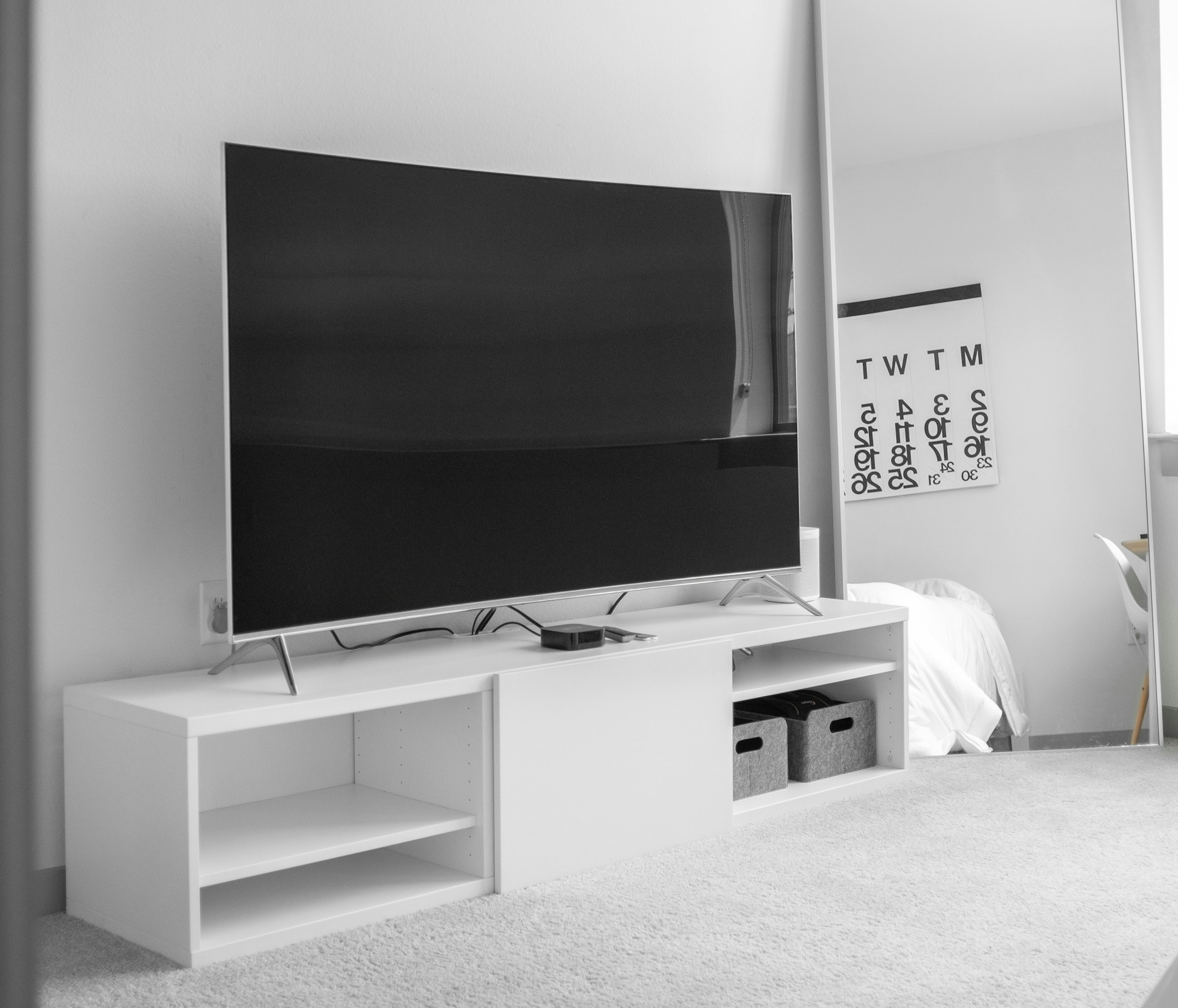 Modern Minimalist White TV Cabinet with Open Shelves.