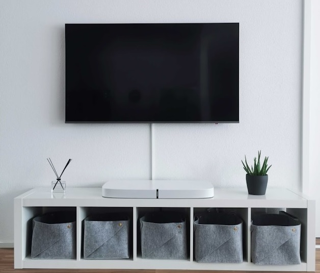 Contemporary White TV Cabinet with Storage Baskets.